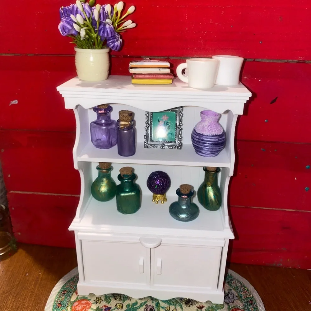 White Miniature Wall Shelf with Colorful Bottles